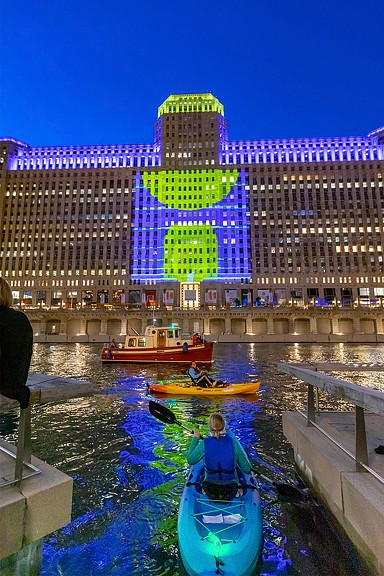 Art on the Mart nighttime view from Chicago river
