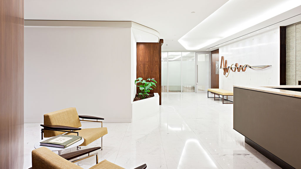 A room with a couch and a table.