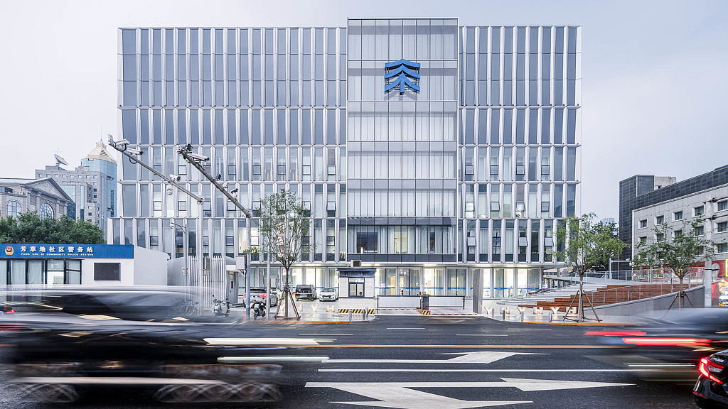 A large building with a flag on top.