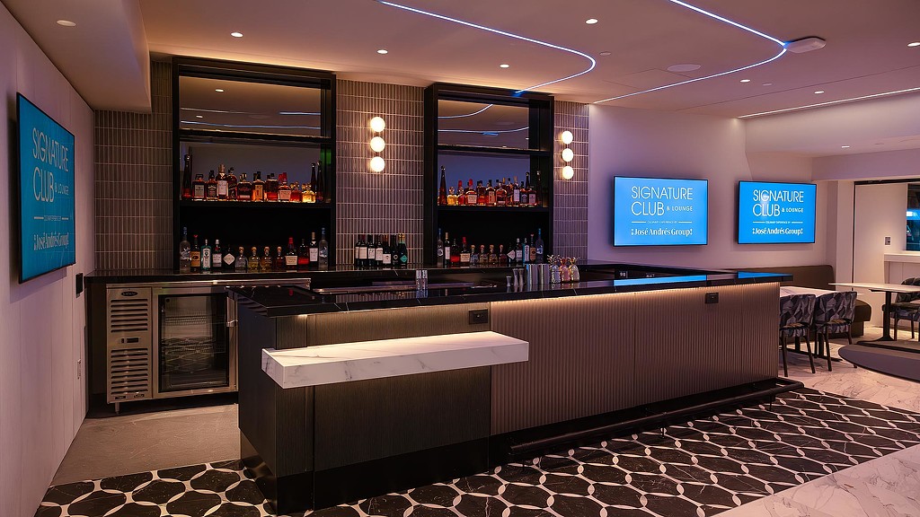 A room with a counter and shelves.