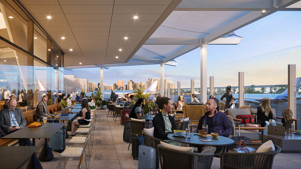 A group of people sitting at tables.