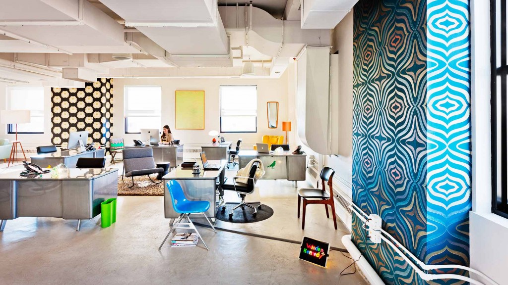 An office with a large table and chairs.