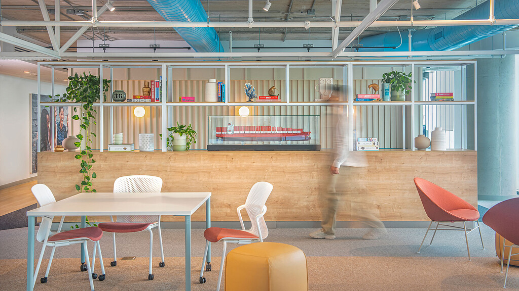 A room with tables and chairs.