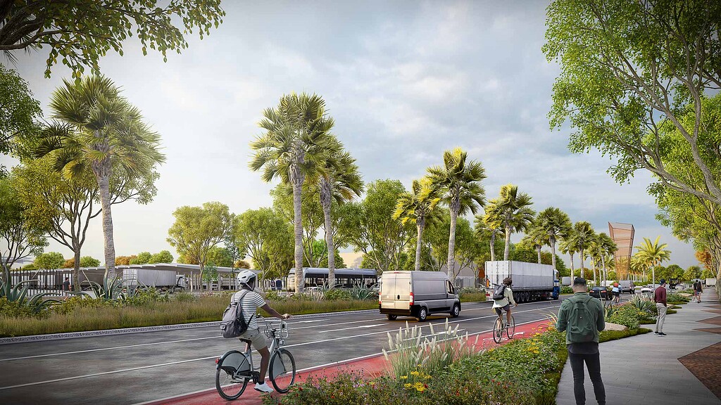 A group of people riding bikes on a road with trees and cars.