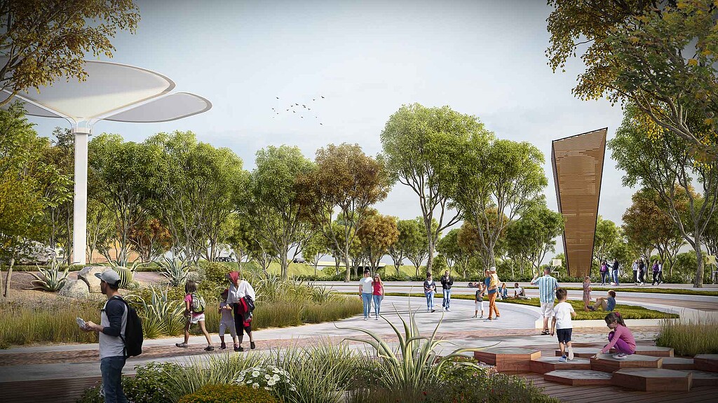 A group of people walking in a park.