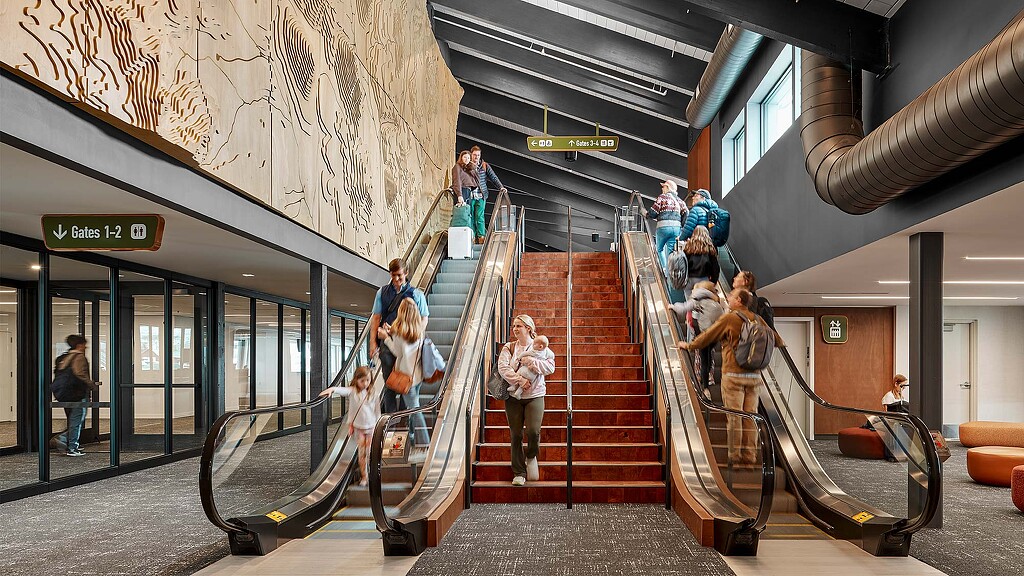 A group of people walking up stairs.