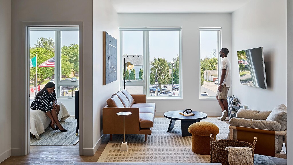 A man and woman in a living room.