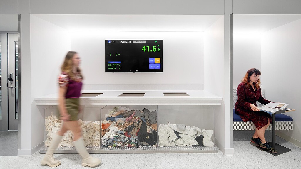 A woman sitting in a chair next to a woman sitting on a bench.