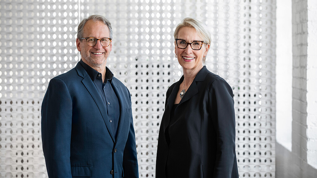 A man and a woman smiling.