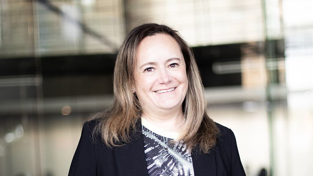 A person smiling for the camera.