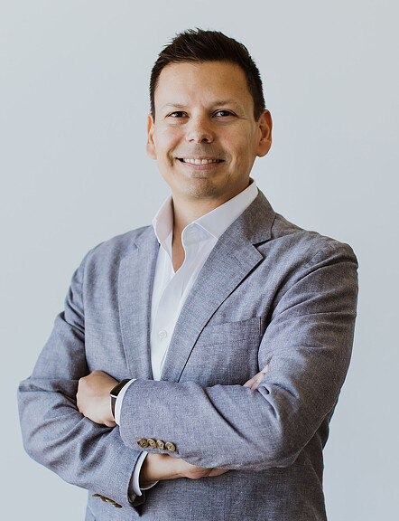 A man folding his arms.