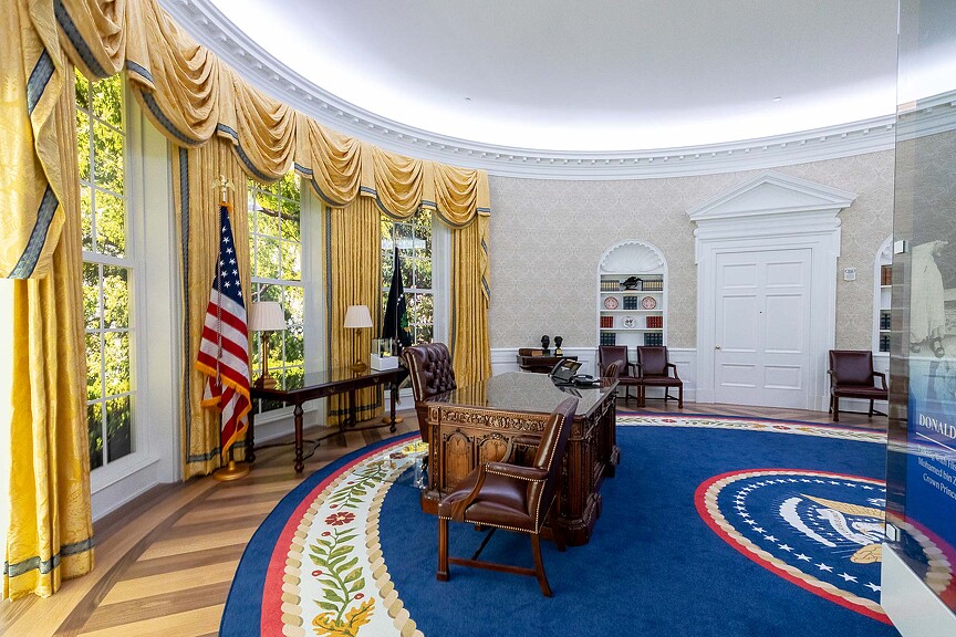 A room with a flag and chairs.