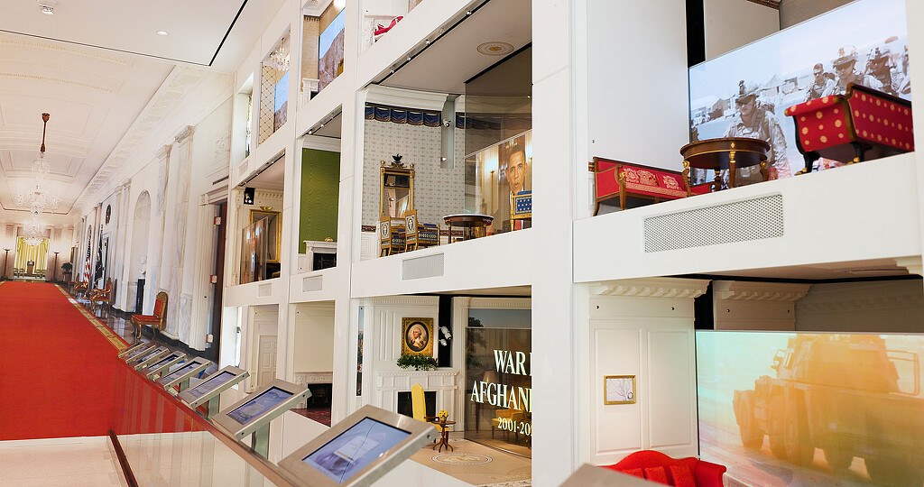 A room with a red carpet and white walls.