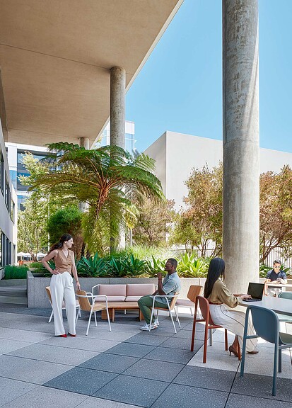 Exterior photo of a group of people sitting outside.