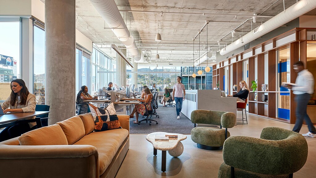 Interior photo of a group of people working in a room.