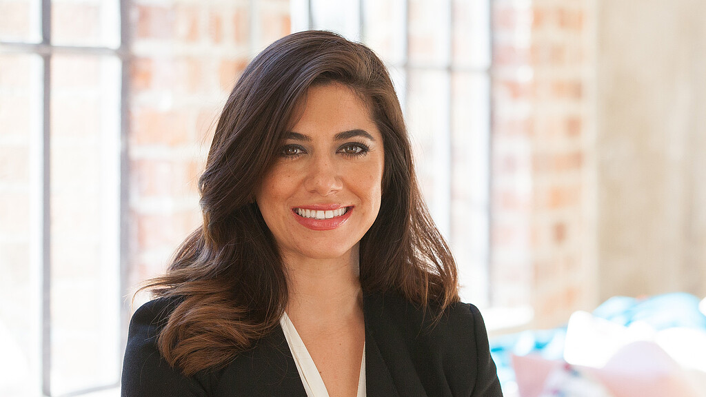 A woman smiling for the camera.