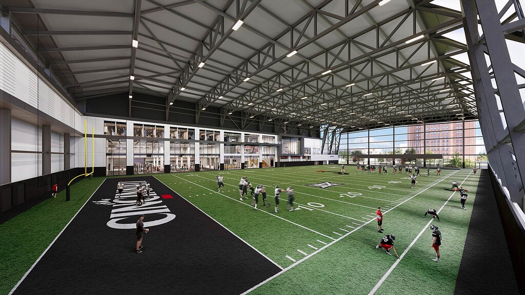 A group of people playing football.