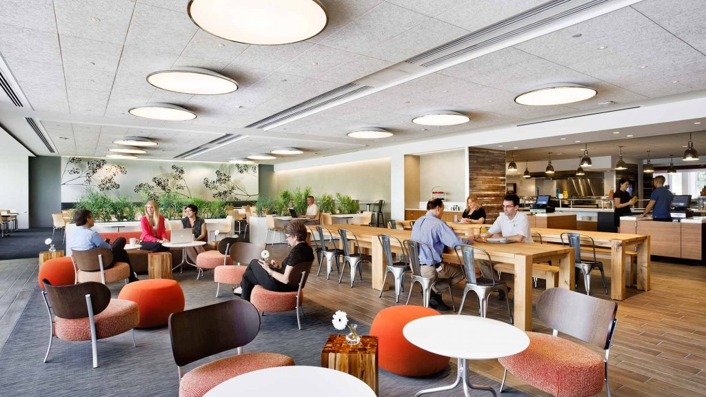A group of people sitting at tables.
