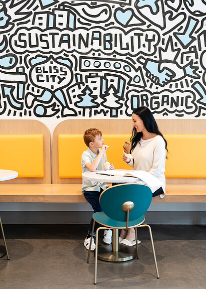 Woman and child eating ice cream at Cosmic Bliss