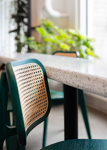 Close-up of chair with rattan back