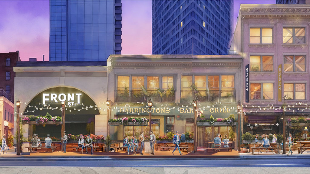 A group of people sitting outside of a building.