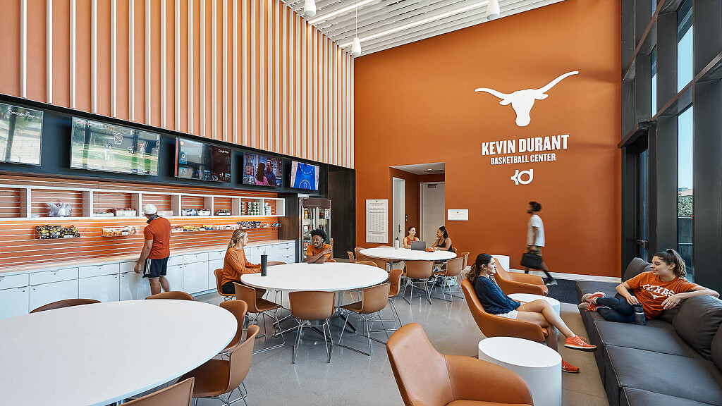 A group of student athletes in a lounge.