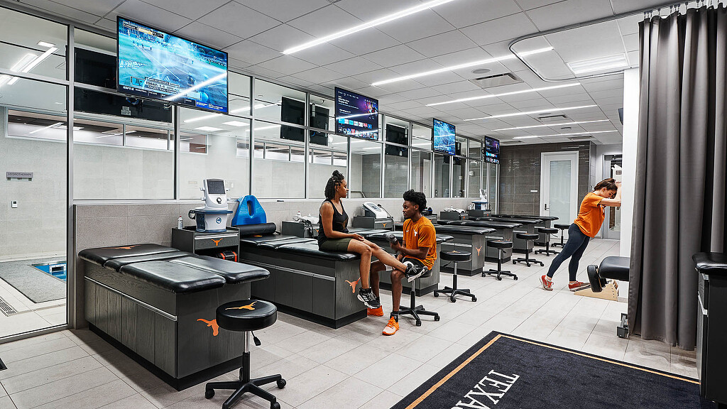A group of student athletes in a medical room.