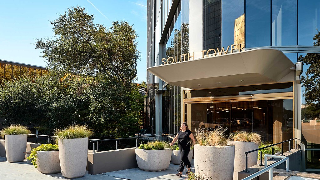 A person standing outside a building.