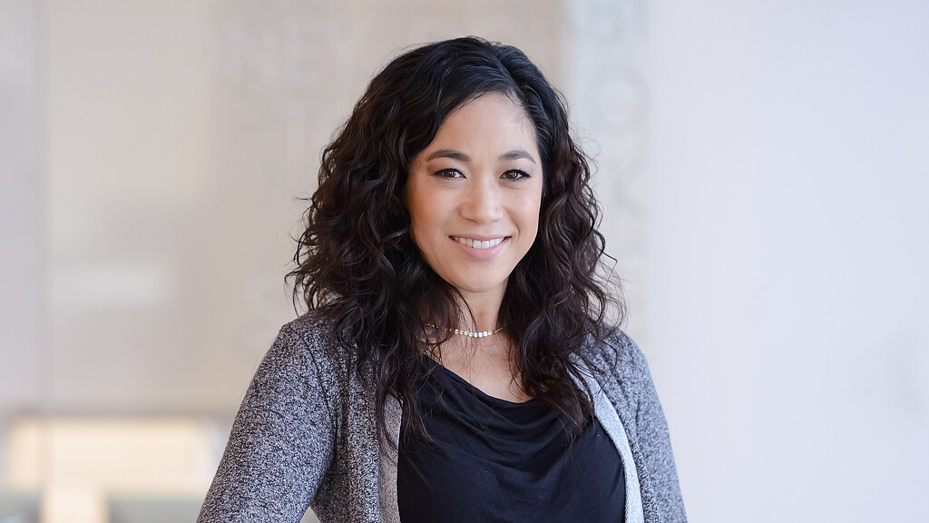 A woman smiling for the camera.