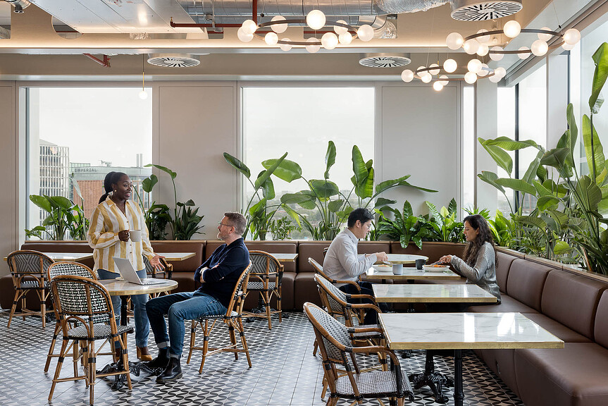 A group of people sitting around a table.