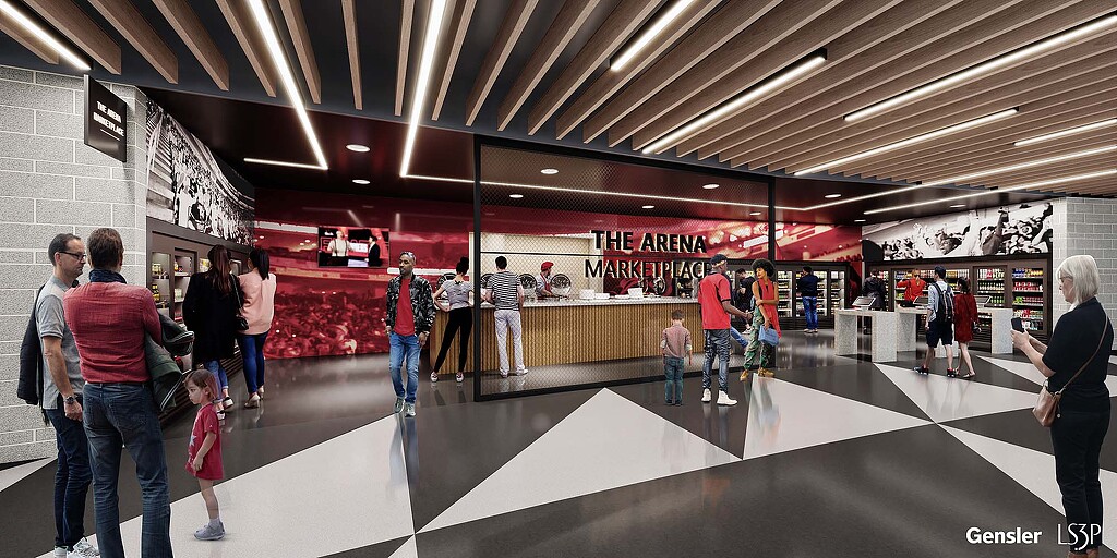 A group of people walking in a building.