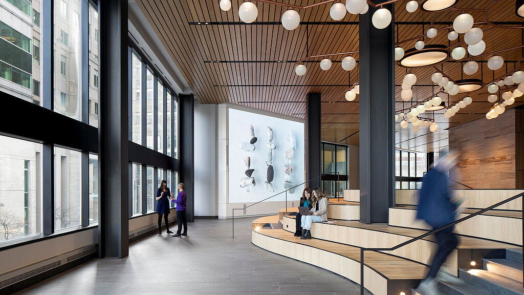 A group of people walking inside a building.