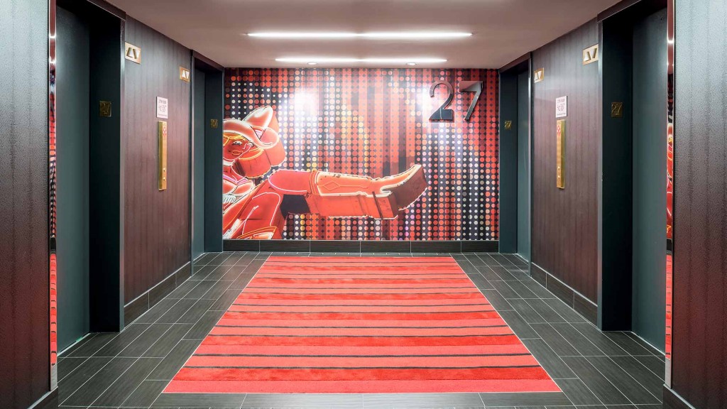 A room with a red floor and a red curtain.
