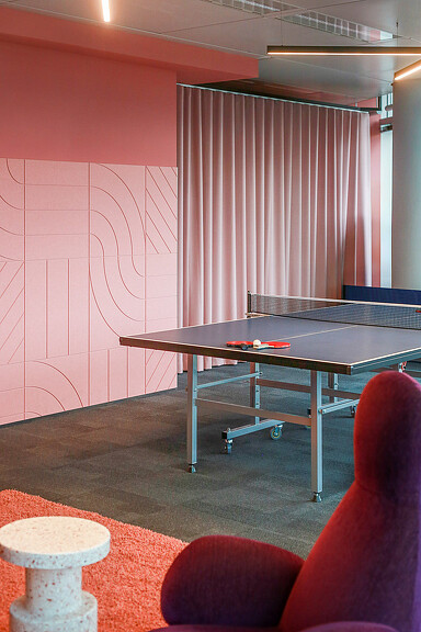 A room with a table and chairs.