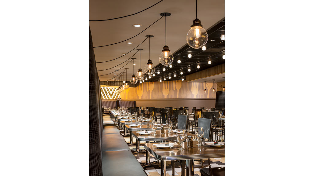 A large room with tables and chairs.