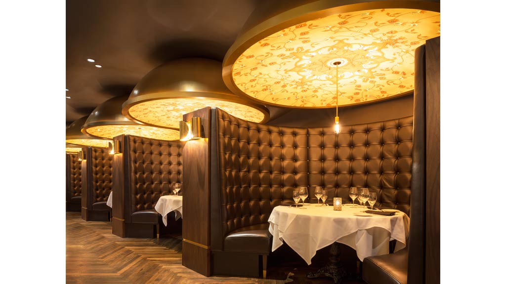 A room with a table and chairs.