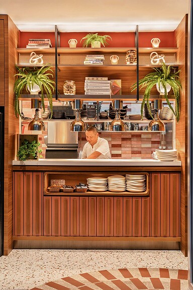 A person behind a counter.