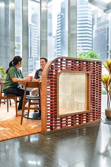 A man and woman sitting at a table in a restaurant.