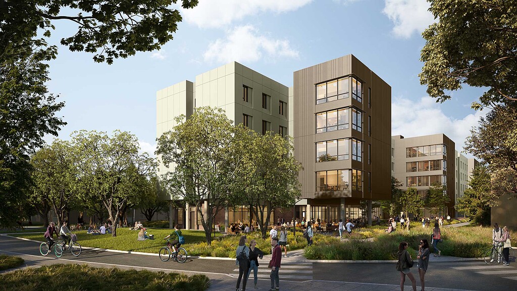 A group of people walking around a building.