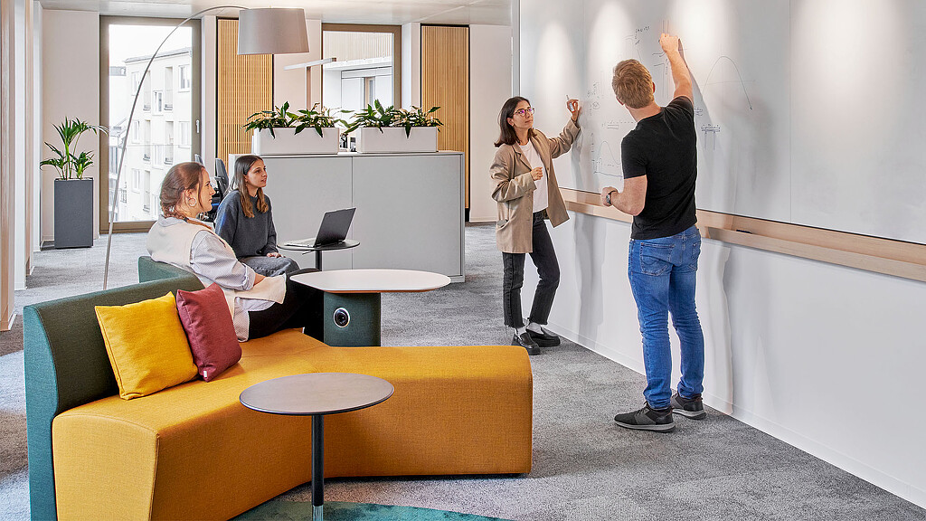 A group of people in a room.