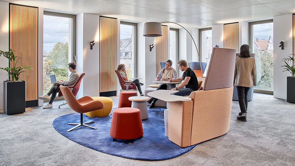 A group of people sitting in chairs.