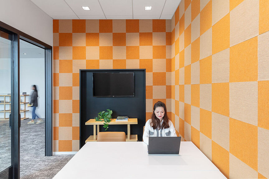 A person sitting at a table with a laptop.