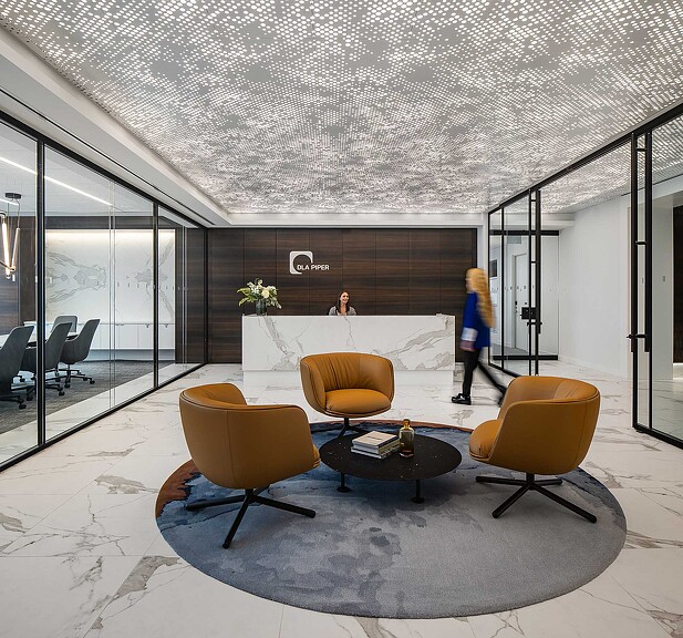 A room with a table chairs and a couch.