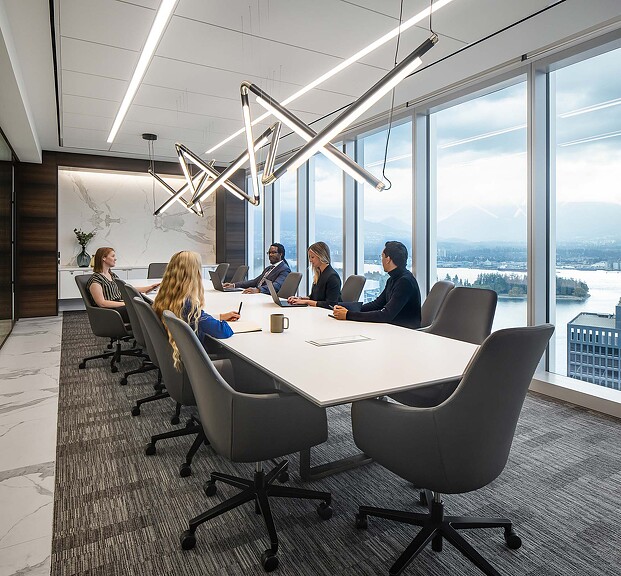 A group of people sitting around a table.