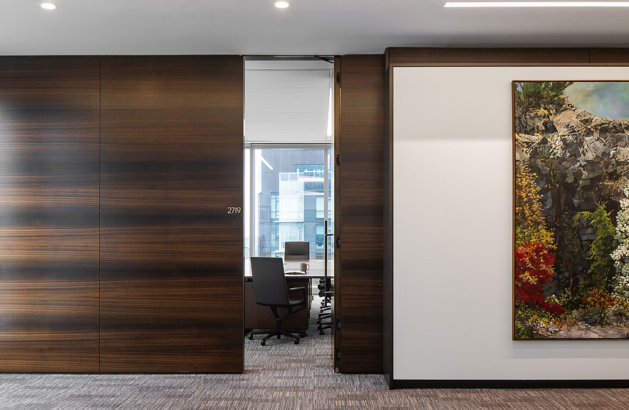 A room with a desk and a chair.