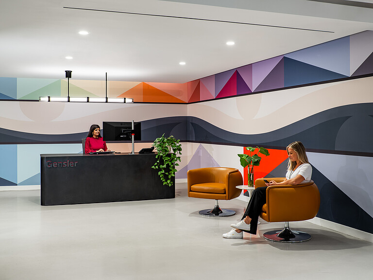 A couple of women sitting in chairs.