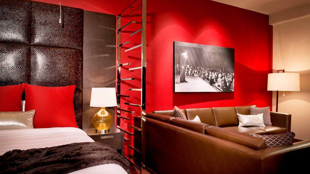 A bedroom with a bed and a couch.