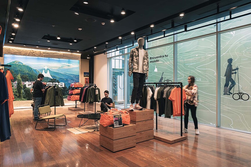 A group of people in a clothing store.