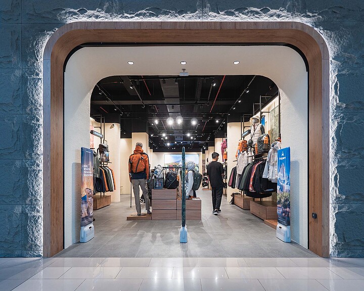 A group of people walking through a building.