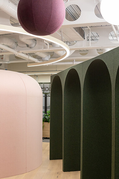 A room with a large fan and a large white ceiling fan.